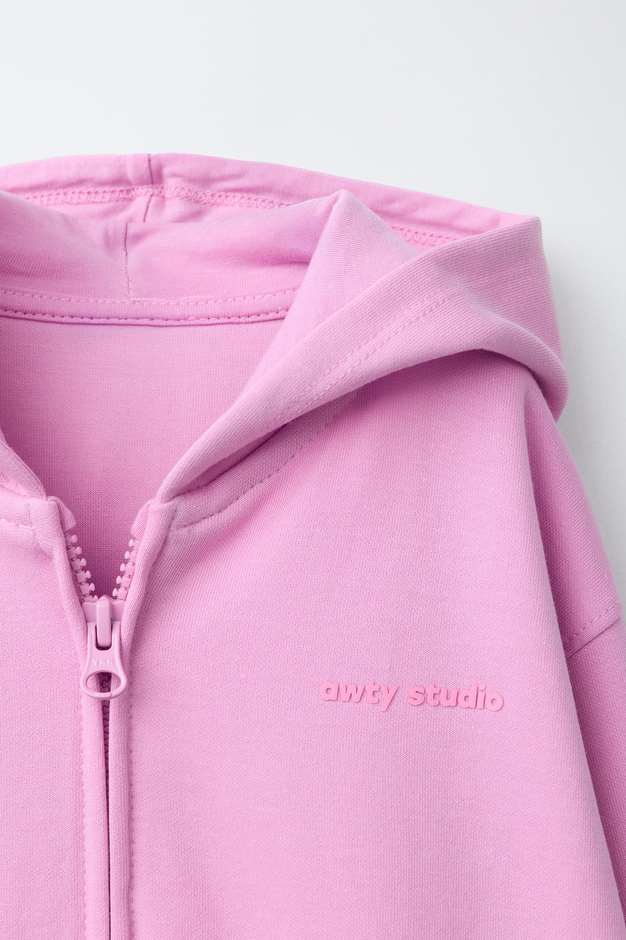 INTERLOCK ZIP SWEATSHIRT WITH RAISED TEXT